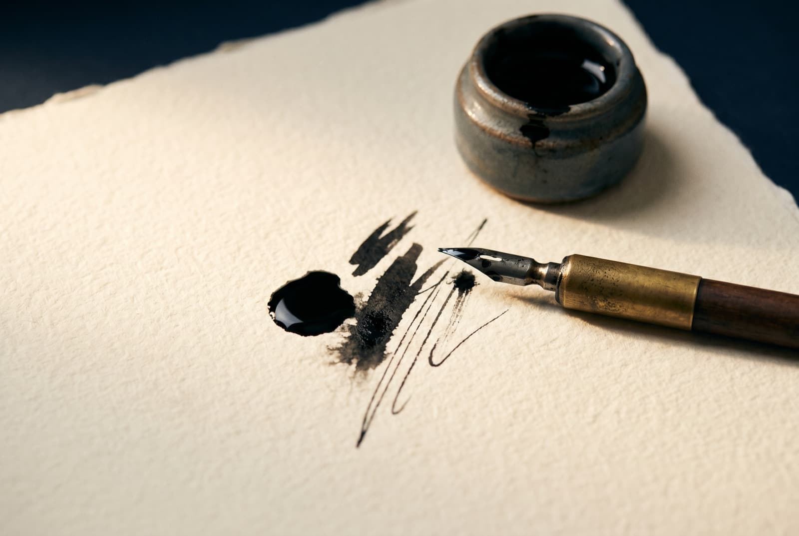 Inking an original tee design by hand